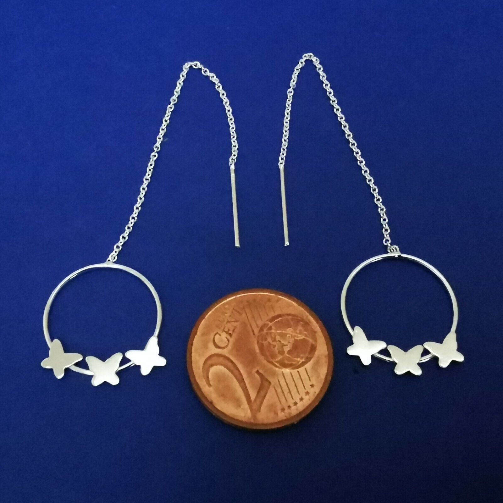 Durchzieher mit Kette und Schmetterlingen auf Ring